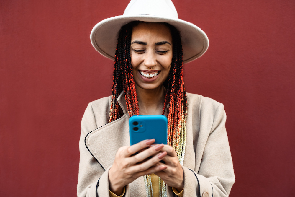 Gen Zers, like the individual shown here, appreciate mental health websites that provide resources about mental health conditions, streamline various parts of the patient process including online scheduling, and more